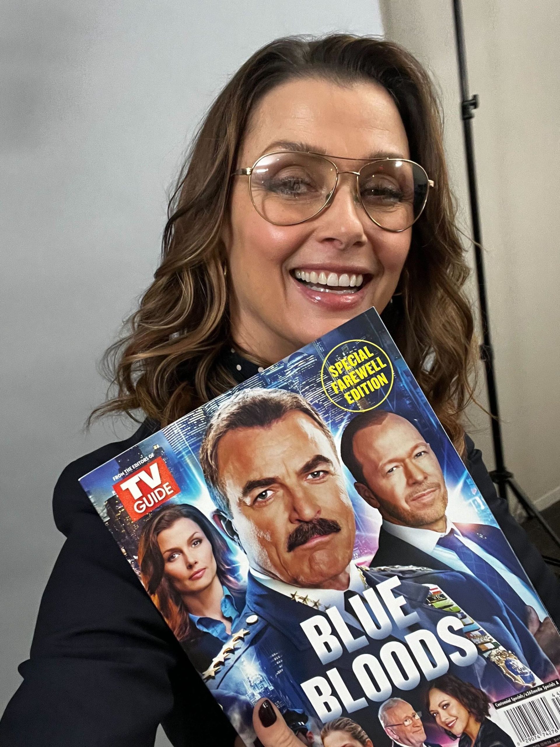 Bridget Moynahan holds a copy of TV Guide Magazine's 'Blue Bloods: The Special Farewell Edition' issue at the TV Insider office